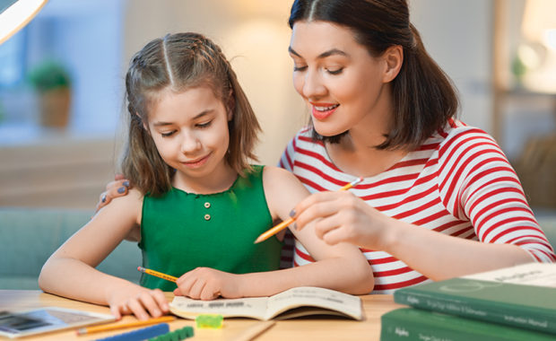 A mother and daughter working on math together.